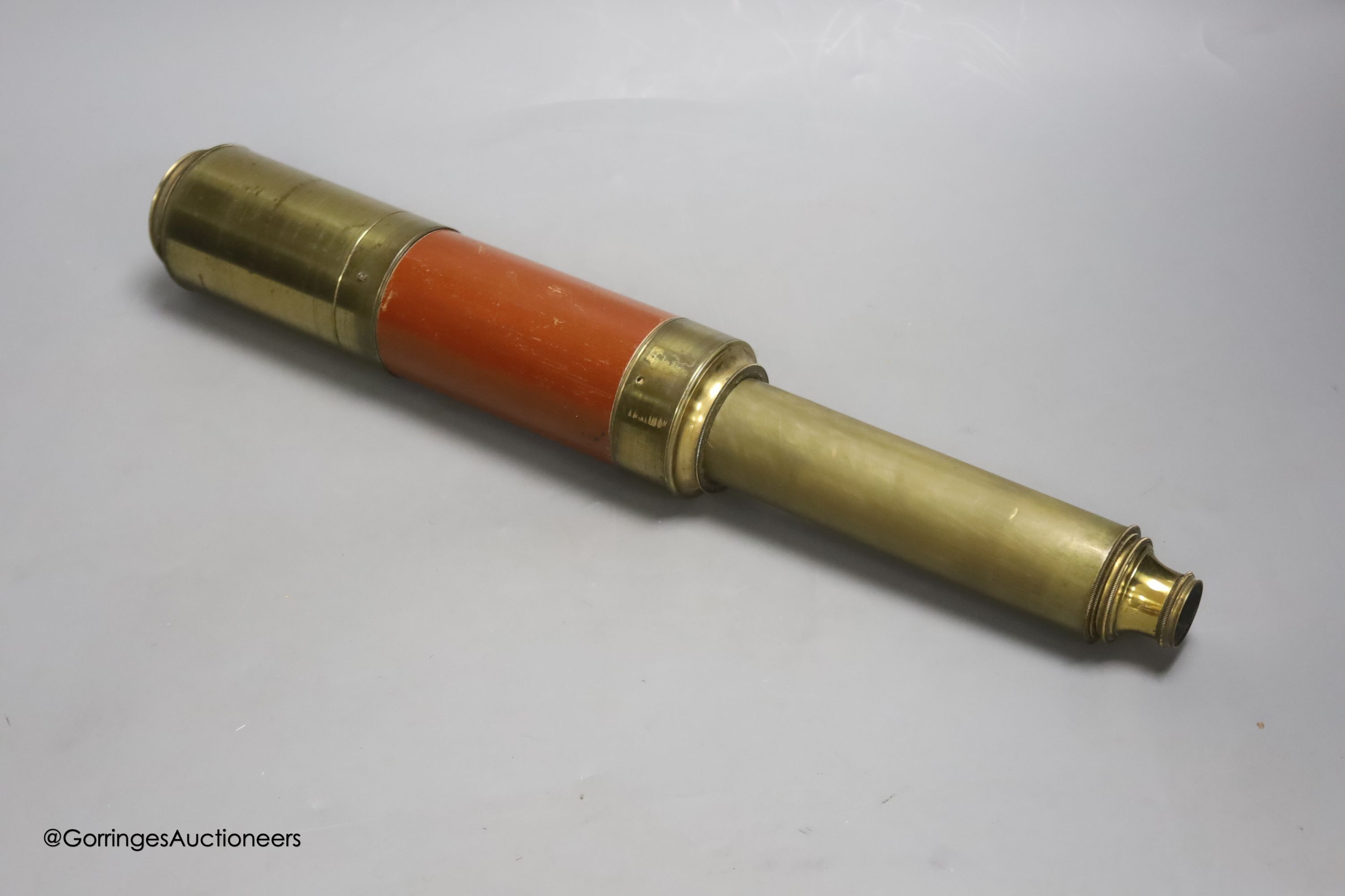 A Dolland of London three drawer brass and leather telescope, fully extended 83cm